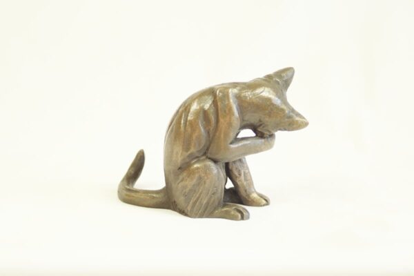 bronze resin Cat washing its face