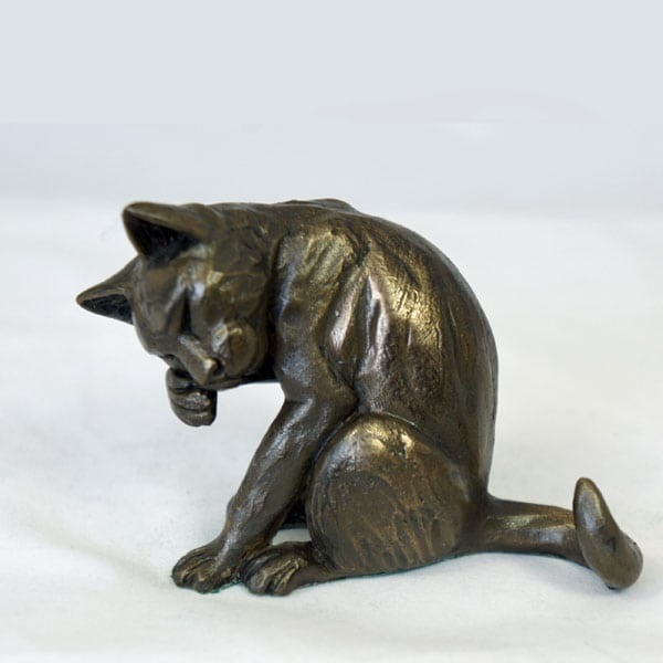 bronze resin Cat washing its face