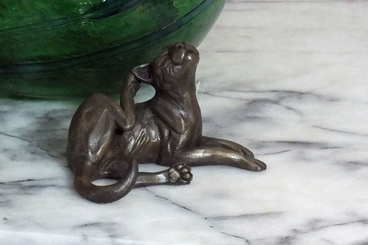 Cat lying scratching - bronze resin sculpture - Pippa Hill Animal Sculptures
